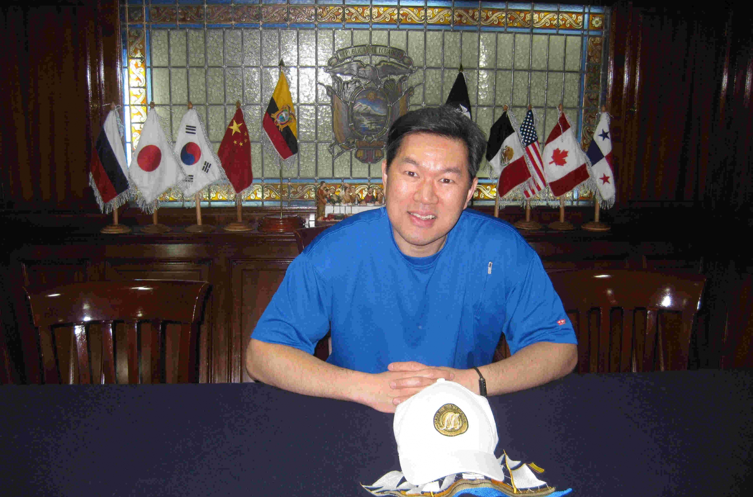 Dr. Kung sitting behind a desk